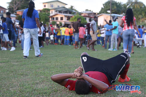 Photo: A Pleasantville Secondary player (foreground) laments the final result after a 3-1 defeat to Shiva Boys Hindu College in SSFL Premier Division action in Pleasantville on 22 October 2016. (Courtesy Chevaughn Christopher/Wired868)