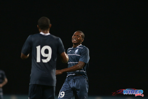 Photo: Police FC attacker Joshua Leach (right) celebrates his maiden league goal with teammate Christon Thomas during Pro League action against Point Fortin Civic at the Ato Boldon Stadium on 18 October 2016. (Courtesy Chevaughn Christopher/Wired868)