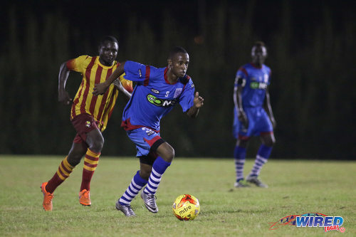 Photo: St Ann's Rangers winger Jomoul Francois (right) accelerates while Point Fortin Civic attacker Sylvester Teesdale looks on during Pro League action on 30 October 2016 at Mahaica Oval. (Courtesy Chevaughn Christopher/Wired868)