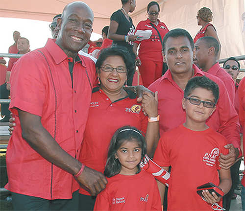 Photo: Prime Minister Dr Keith Rowley (far left) poses with PNM deputy political leader Rohan Sinanan (right) and his family. (Copyright Trinidad Guardian)