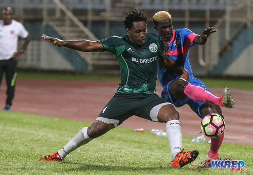 Photo: Club Sando winger Akeem Roach (right) tries to escape from W Connection defender Maurice Ford during Pro League action at the Ato Boldon Stadium in Couva on 14 October 2016. (Courtesy Sean Morrison/Wired868)