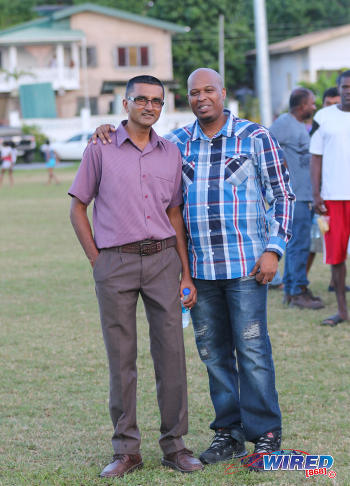 Photo: Shiva Boys Hindu College principal Dexter Saklal (left) poses with a football supporter during SSFL Premier Division action against St Mary's College at Lachoo Road on 19 October 2016. (Courtesy Sean Morrison/Wired868)