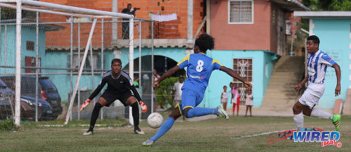 Photo: Shiva Boys Hindu College attacker Junior Asson (centre) prepares to fire at goal while St Mary's College goalkeeper Jordan Bidaisee (left) and defender Emilio Saunders look on during SSFL Premier Division action at Lachoo Road on 19 October 2016. (Courtesy Sean Morrison/Wired868)