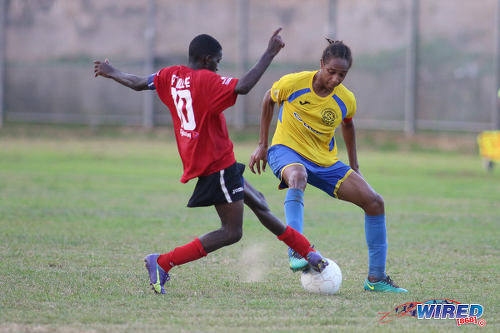 Photo: Shiva Boys Hindu College stand-in captain Tyrel "Pappy" Emmanuel (right) and Pleasantville Secondary captain Jude Phillip contest the ball during SSFL Premier Division action on 22 October 2016. (Courtesy Chevaughn Christopher/Wired868)