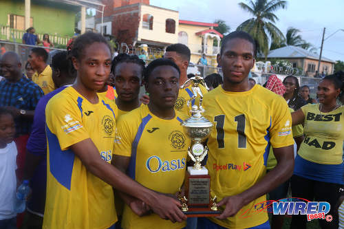 Photo: Shiva Boys Hindu College players (foreground, from left) Tyrel "Pappy" Emmanuel, Quinn Rodney and Yohannes Richardson pose with the SSFL Premier Division trophy in Pleasantville on 22 October 2016. (Courtesy Chevaughn Christopher/Wired868)