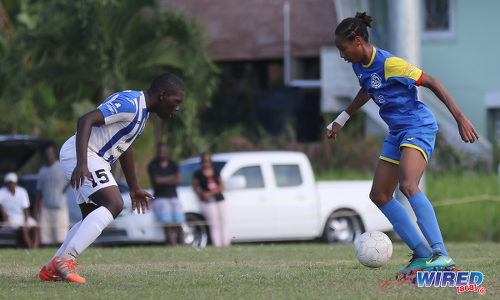 Photo: Shiva Boys Hindu College stand-in captain Tyrel "Pappy" Emmanuel (right) takes on St Mary's College defender Nathan Harte during SSFL Premier Division action at Lachoo Road on 19 October 2016. (Courtesy Sean Morrison/Wired868)