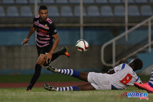 Photo: Ma Pau Stars right back Carlos Edwards (left) gets past St Ann's Rangers defender Jameel Antoine during Pro League action at the Ato Boldon Stadium on 18 October 2016. (Courtesy Chevaughn Christopher/Wired868)