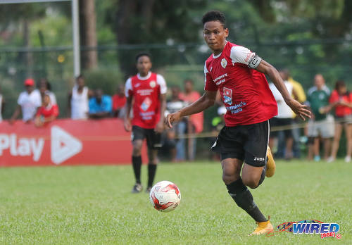 Photo: St Anthony's College midfielder and captain Jules Lee (right) during SSFL Premier Division action against Naparima College on 15 October 2016. (Courtesy Sean Morrison/Wired868)