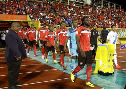 Photo: The Trinidad and Tobago National Senior Team heads to the playing field for World Cup qualifying action against Guatemala at the Hasely Crawford stadium in Port-of-Spain on 2 September 2016. (Copyright AFP 2016/Alva Viarruel)