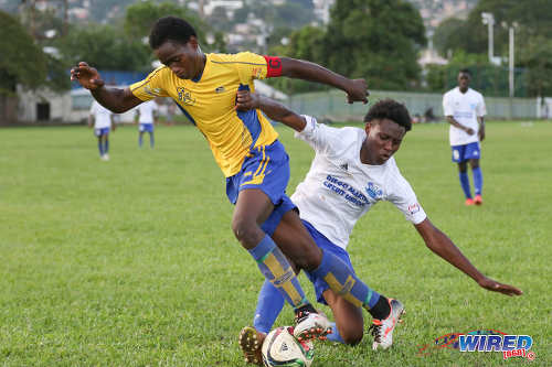 Photo: Diego Martin North Secondary player Teon Pierre (right) tackles Blanchisseuse Secondary captain Trilon Kirk during North Zone Intercol action at the St Mary's College ground in St Clair on 2 November 2016. (Courtesy Sean Morrison/Wired868)