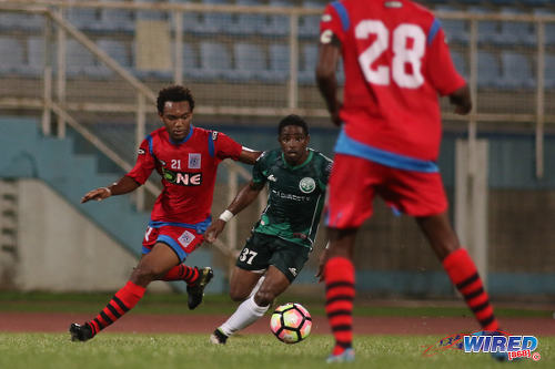 Photo: W Connection attacker Daniel Diaz (centre) is followed by St Ann's Rangers winger Josh Toussaint (left) during Pro League action at the Ato Boldon Stadium on 4 November 2016. (Courtesy Chevaughn Christopher/Wired868)