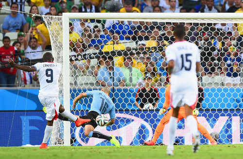 Photo: Costa Rica striker Joel Campbell (left) drives home against Uruguay at the 2014 World Cup. (Copyright Daily Star)