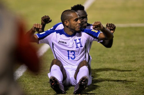 Photo: Honduras striker Eddie Hernandez (front) celebrates after scoring against Trinidad & Tobago during their 2018 FIFA World Cup qualifier football match in San Pedro Sula, Honduras on 15 November 2016. (Copyright AFP 2016/Gerardo Mazariegos)