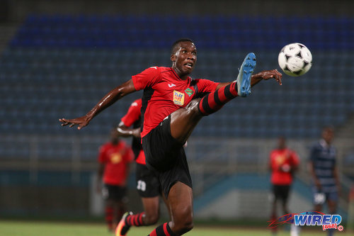 Photo: San Juan Jabloteh forward Jamal Gay stretches for the ball during Pro League against Police FC at the Ato Boldon Stadium on 1 November 2016. Jabloteh won 3-2. (Courtesy Chevaughn Christopher/Wired868)