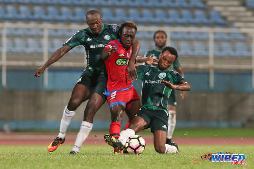 Photo: St Ann's Rangers midfielder Jameel Antoine (centre) is harassed by W Connection players Daneil Cyrus (left) and Kevon Goddard during Pro League action at the Ato Boldon Stadium on 4 November 2016. (Courtesy Chevaughn Christopher/Wired868)