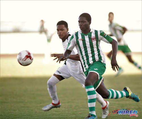 Photo: San Juan North Secondary striker Renaldo Boyce (right) takes on a St Augustine opponent during the East Zone Intercol final at the Larry Gomes Stadium, Malabar on 21 November 2016. (Courtesy Annalicia Caruth/Wired868)