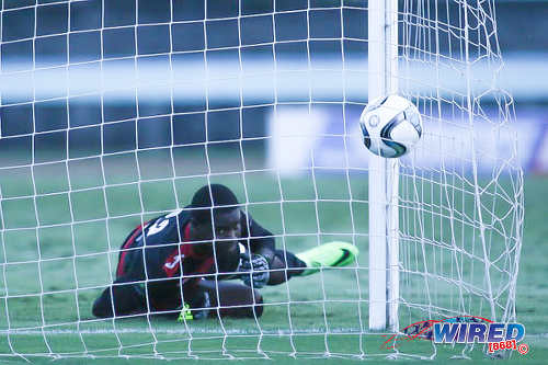 Photo: Shiva Boys Hindu College goalkeeper Denzil Smith looks for the ball in the back of the net during during the penalty shootout which decided South Zone Intercol final in favour of Presentation College (San Fernando) at the Mannie Ramjohn Stadium on 18 November 2016. (Courtesy Chevaughn Christopher/Wired868)