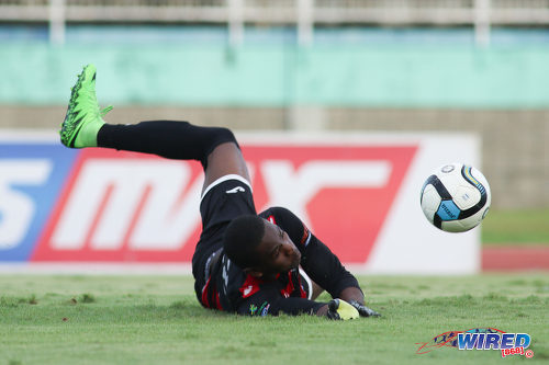 Photo: Shiva Boys Hindu College goalkeeper Denzil Smith makes a low save during the South Zone Intercol final against Presentation College (San Fernando) at the Mannie Ramjohn Stadium on 18 November 2016. (Courtesy Chevaughn Christopher/Wired868)