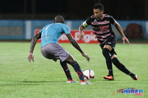 Photo: Ma Pau Stars right back Carlos Edwards (right) takes on Morvant Caledonia United attacker Kordell Samuel during Pro League at the Ato Boldon Stadium in Couva on 22 November 2016. (Courtesy Sean Morrison/Wired868)