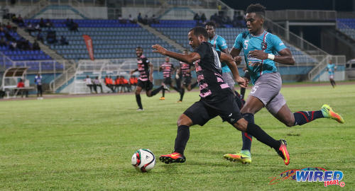 Photo: Ma Pau Stars winger Hayden Tinto (left) takes on Morvant Caledonia United defender Seon Thomas during Pro League at the Ato Boldon Stadium in Couva on 22 November 2016. (Courtesy Sean Morrison/Wired868)