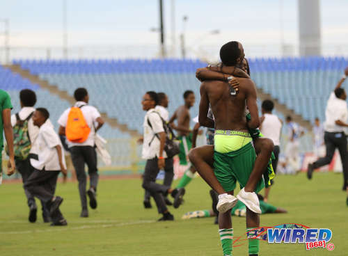 Photo: A Trinity College Moka player is embraced by a female support after his team eliminated St Mary's College in the North Zone Intercol semifinal at the Hasely Crawford Stadium on 16 November 2016. (Copyright Sean Morrison/Wired868)