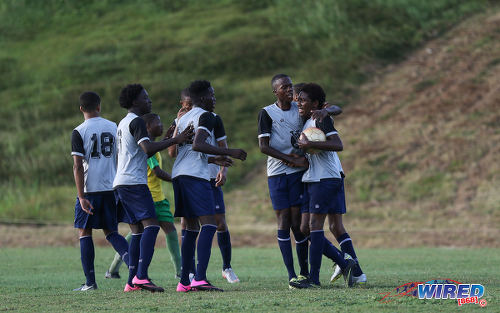 Photo: Trinity College East striker Dwight Yorke (far right) is congratulated by teammates during SSFL Championship Big 5 Play Off action away to Princes Town West Secondary on 4 November 2016. (Courtesy Sean Morrison/Wired868)