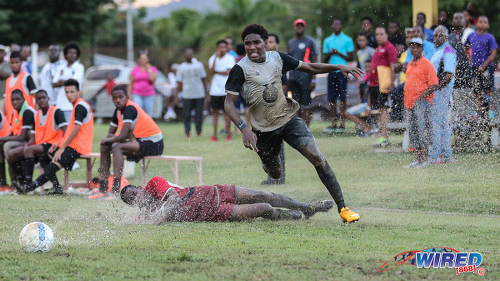 Photo: Trinity College East attacker Dwight Yorke (right) leaves a Malick Secondary opponent for dead during Championship Big 5 Play Off action in Trincity on 6 November 2016. (Courtesy Sean Morrison/Wired868)