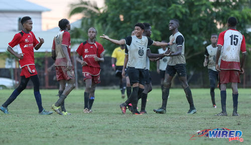 Photo: Trinity College East attacker Kishon Hackshaw (centre) acts as peacemaker while teammate Nickel Orr (second from right) and Malick Secondary captain Brandon Charles (second from left) exchange unpleasantries during Championship Big 5 Play Off action in Trincity on 6 November 2016. Looking on (third from left) is Malick maestro Shaquille Mayers. (Courtesy Sean Morrison/Wired868)