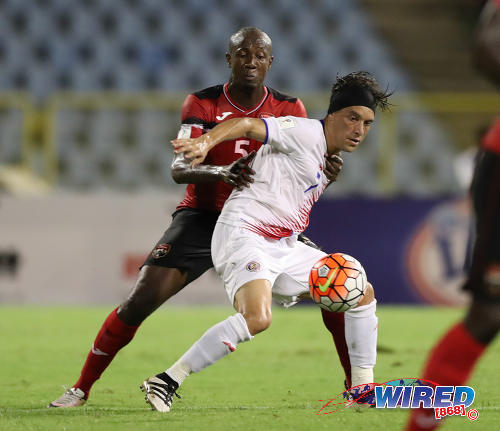 Photo: Trinidad and Tobago right back Daneil Cyrus (left) tries to hang on to Costa Rica attacker Christian Bolanos during Russia 2018 World Cup qualifying action against Costa Rica at the Hasely Crawford Stadium on 11 November 2016. (Courtesy Allan V Crane/Wired868)