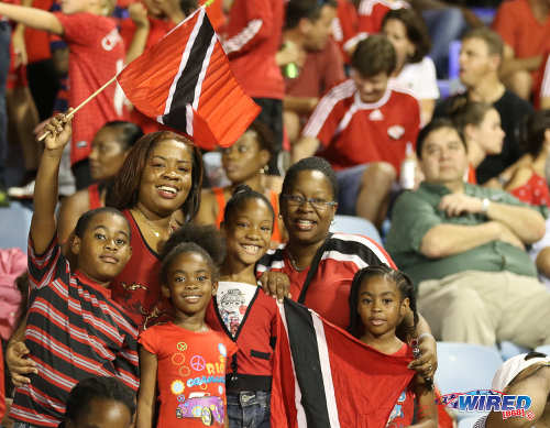 Photo: Trinidad and Tobago supporters pose for a photograph during a break in Russia 2018 World Cup qualifying action against Costa Rica at the Hasely Crawford Stadium on 11 November 2016. (Courtesy Sean Morrison/Wired868)