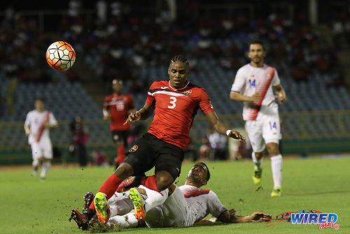 Photo: Trinidad and Tobago winger Joevin Jones (centre) is tackled by two Costa Rican players during Russia 2018 World Cup qualifying action at the Hasely Crawford Stadium on 11 November 2016. (Courtesy Sean Morrison/Wired868)