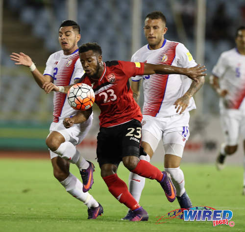 Photo: Trinidad and Tobago midfielder Jomal Williams (centre) tries hold off Costa Rica defenders Johnny Acosta (left) and Francisco Calvo during Russia 2018 World Cup qualifying action against Costa Rica at the Hasely Crawford Stadium on 11 November 2016. (Courtesy Allan V Crane/Wired868)