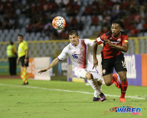 Photo: Trinidad and Tobago winger Levi Garcia (right) dashes past Costa Rica right wing back Christian Gamboa during Russia 2018 World Cup qualifying action at the Hasely Crawford Stadium on 11 November 2016. (Courtesy Sean Morrison/Wired868)