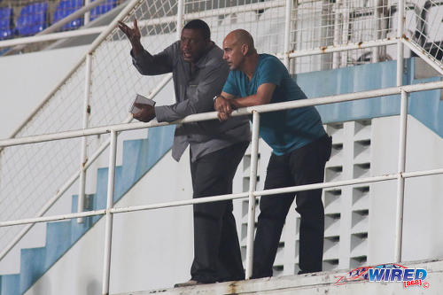 Photo: Trinidad and Tobago Football Association (TTFA) president and W Connection owner David John-Williams (left) has a word with Soca Warriors coach Stephen Hart during Pro League action at the Ato Boldon Stadium on 4 November 2016. (Courtesy Chevaughn Christopher/Wired868)