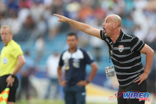 Photo: Trinidad and Tobago National Senior Team coach Stephen Hart (right) shouts instructions during 2018 World Cup qualifying action against Honduras in San Pedro Sula on 15 November 2016. (Courtesy Allan V Crane/CA-Images/Wired868)