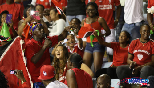 Photo: Trinidad and Tobago soca legend Superblue (left) serenades Soca Warriors fans during Russia 2018 World Cup qualifying action against Costa Rica at the Hasely Crawford Stadium on 11 November 2016. (Courtesy Sean Morrison/Wired868)