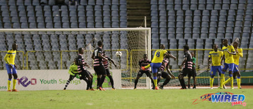 Photo: Defence Force midfielder Chris Durity (centre) shoots for goal during First Citizens Bank Cup final action against Ma Pau Stars at the Hasely Crawford Stadium, Port of Spain on 2 December 2016. (Courtesy Sean Morrison/Wired868)