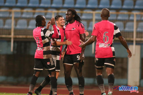 Photo: Central FC forward Kenwyne Jones (second from right) is congratulated by midfielder Sean De Silva (second from left) after his decisive goal against W Connection during Pro League action at the Ato Boldon Stadium in Couva on 12 December 2016. (Courtesy Chevaughn Christopher/Wired868