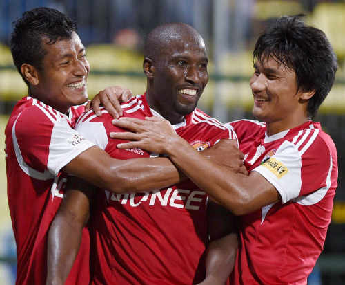 Photo: Trinidad and Tobago international striker Cornell Glen (centre) celebrates with teammates during his spell with I-League team, Shillong Lajong FC. (Copyright DNA India)