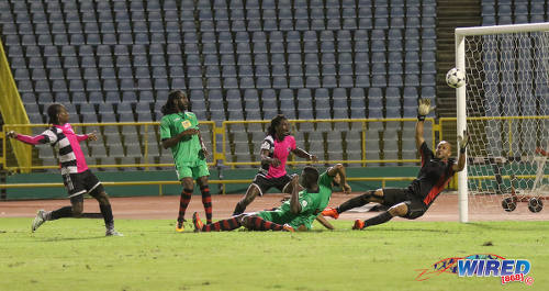 Photo: San Juan Jabloteh goalkeeper Shem Louison (far right) tries in vain to keep out an attempt at goal by Central FC captain Darren Mitchell (far left) during Pro League action at the Hasely Crawford Stadium on 2 December 2016. (Courtesy Sean Morrison/Wired868)