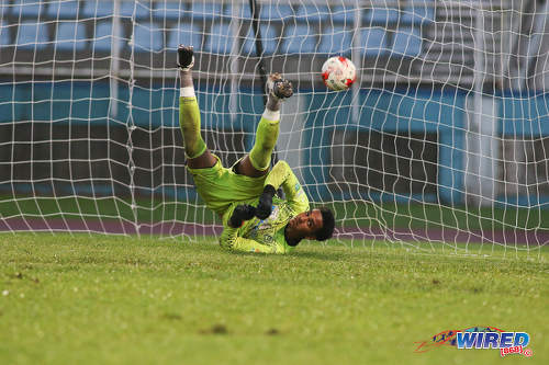 Photo: Naparima College custodian Levi Fernandez is completely outfoxed by a penalty from Presentation College (San Fernando) substitute Omri Baird during the Big Four final at the Ato Boldon Stadium, Couva on 12 December 2016. Fernandez had the last laugh, though, as Naparima won 2-1. (Courtesy Chevaughn Christopher/Wired868)