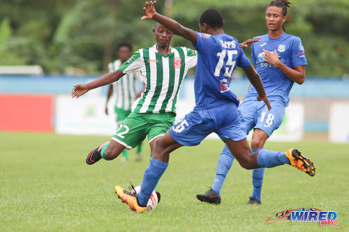 Photo: My ball! San Juan North Secondary midfielder Nathaniel Perouse (left) and Naparima College defender Shadeon Arthur (centre) go for the ball during the SSFL Big Four semifinals on 9 December 2016 at the Ato Boldon Stadium in Couva. (Courtesy Chevaughn Christopher/Wired868)