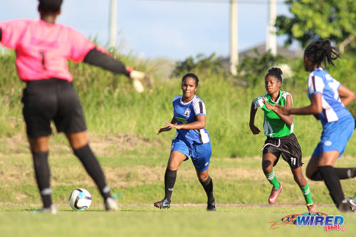 Photo: Penal Secondary attacker Kayla Garcia (second from right) tries to get past the Fyzabad Anglican Secondary defence during the Girls South Zone Knockout final at the Mannie Ramjohn Stadium training ground on 2 December 2016. (Courtesy Chevaughn Christopher/Wired868)