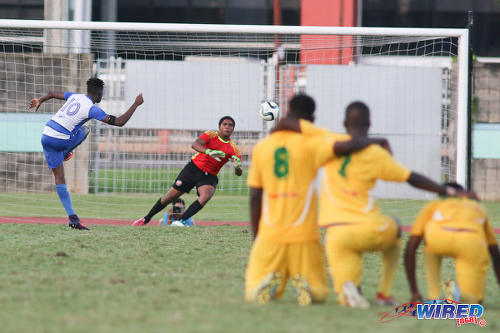 Photo: Presentation College (San Fernando) captain Kareem Riley (left) places his penalty past Signal Hill Secondary goalkeeper Njeri Fermin during the National Intercol Semifinals at the Mannie Ramjohn Stadium on 3 December 2016. Presentation won 5-3 on kicks from the penalty mark to advance to the National Intercol finals. (Courtesy Chevaughn Christopher/Wired868)