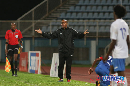 Photo: Presentation College (San Fernando) coach Shawn Cooper (centre) gestures from the sidelines during their SSFL Big Four semifinal contest against Shiva Boys Hindu College on 9 December 2016 at the Ato Boldon Stadium in Couva. (Courtesy Chevaughn Christopher/Wired868)