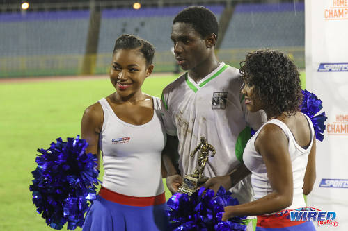 Photo: San Juan Secondary striker Renaldo Boyce (centre) poses with a Man of the Match trophy after scoring four times to lead his school past Trinity College Moka in the National Intercol semifinals at the Hasely Crawford Stadium on 30 November 2016. (Courtesy Sean Morrison/Wired868)