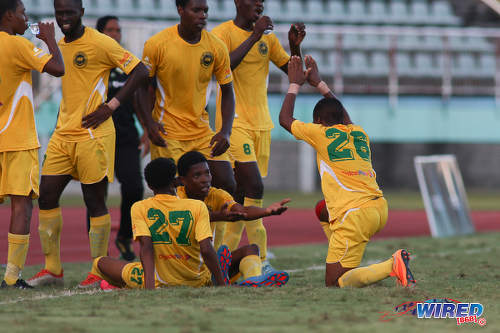 Photo: Signal Hill Secondary goal scorer Ronaldo Samuel (far right) celebrates with his teammates during National Intercol Semifinal action against Presentation College (San Fernando) at the Mannie Ramjohn Stadium on 3 December 2016. (Courtesy Chevaughn Christopher/Wired868)