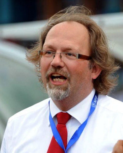 Photo: Belgian coach Tom Saintfiet watches from the sidelines as his Malawi team tackles Nigeria in 2014 World Cup qualifying action on 7 September 2013.  (Copyright AFP 2016/Pius Utomi Ekpei)