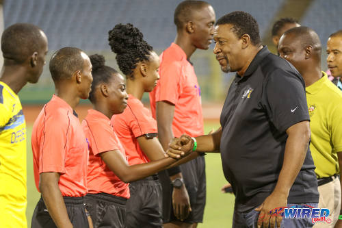 Photo: TTFA president David John-Williams (right) smiles with fourth official Cecile Hinds before the First Citizens Bank Cup final between Defence Force and Ma Pau Stars at the Ato Boldon Stadium on 2 December 2016. (Courtesy Chevaughn Christopher/Wired868)