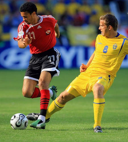 Photo: Trinidad and Tobago midfielder Carlos Edwards (left) takes on Sweden midfielder Anders Svensson during the Germany 2006 World Cup group B opener on 10 June 2006 at Dortmund stadium.  Edwards is the captain of the current Soca Warriors team. (Copyright AFP 2016/Odd Andersen)